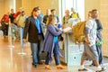 Passengers queued in line for boarding at departure gate