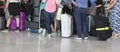 Passengers in row waiting check-in counters at airport at Paris, France Royalty Free Stock Photo