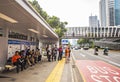 Passengers in a shelter in the busy Sudirman Street traffic, Central Business District of Jakarta, Indonesia