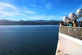 Passengers on a ship marvel at the beauty of the coastal scenery on the ferry between the south and north island of New Zealand