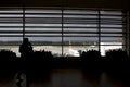 Passengers silhouette in waiting lounge of Pegasus Royalty Free Stock Photo