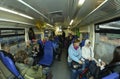 Passengers sitting on seats in a wagon of a commuter train, waiting for departure Royalty Free Stock Photo