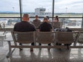 Passengers Sitting and Waiting for Departure, Watching Flights, The Control Tower, and the Area in Front of the Airport