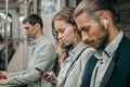 passengers with smartphones sitting in a subway car . Royalty Free Stock Photo