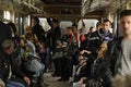 Passengers standing and sitting in subway car crowded. Kyiv, Ukraine