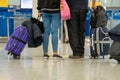 Passengers with suitcases are walking along the Airport waiting room Royalty Free Stock Photo