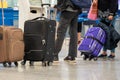 Passengers with suitcases are walking along the Airport waiting room Royalty Free Stock Photo