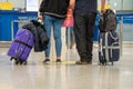 Passengers with suitcases are walking along the Airport waiting room Royalty Free Stock Photo