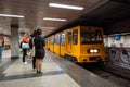 Passengers about to board yellow train wagons of Budapest subway Royalty Free Stock Photo