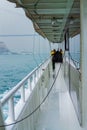 Passengers on tour ship Bosphorus strait on rainy spring day Istanbul city Turkey Royalty Free Stock Photo