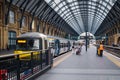 Passengers and trains at King's Cross station in London Royalty Free Stock Photo