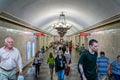 Passengers in underground passageway to metro platforms in St Petersburg Metro in St Petersburg, Russia