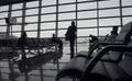 Passengers wait to board at departure lounge