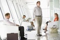 Passengers waiting in airport departure lounge Royalty Free Stock Photo