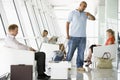 Passengers waiting in airport departure lounge Royalty Free Stock Photo