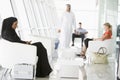 Passengers waiting in airport departure lounge Royalty Free Stock Photo