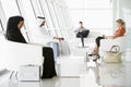 Passengers waiting in airport departure lounge Royalty Free Stock Photo