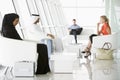 Passengers waiting in airport departure lounge Royalty Free Stock Photo