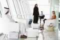 Passengers waiting in airport departure lounge Royalty Free Stock Photo