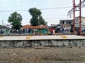 The passengers are waiting the arrival of commuter train in Tambun, West Java, Indonesia Royalty Free Stock Photo