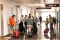 Passengers waiting in the corridor for a flight Royalty Free Stock Photo