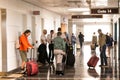 Passengers waiting in the corridor for a flight