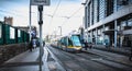 Passengers waiting for an electric tram in Dublin, Ireland