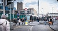 Passengers waiting for an electric tram in Dublin, Ireland