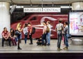 Passengers waiting on a platform in Brussels Central station as a Thalys high-speed train is passing by