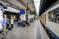 Passengers waiting on a platform in Brussels Central station while an InterCity train is stationing Royalty Free Stock Photo