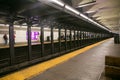 Passengers waiting for the subway at Grand Station, Brooklyn, New York