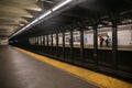 Passengers waiting for the subway at Grand Station, Brooklyn, New York