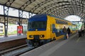 Passengers waiting for a train on the platform Royalty Free Stock Photo