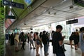 Passengers waiting for trains to Kheha at the lower level of Siam BTS Interchange Station, Bangkok