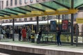 Passengers waiting for a tram on the platform at St Peters Square Station.  Public Transport Vehicle.  People in shot Royalty Free Stock Photo