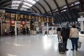 Passengers waiting at York Railways station by Train Information display showing train times, arivals and departures Royalty Free Stock Photo