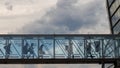 Passengers walk on a jet bridge at airport