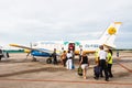 Passengers walk to board small plane at Varadero airport. Aerocaribbean airline