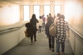 passengers walk on walk way to get in airplane,travel concept