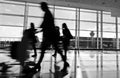Passengers walking through in airport Royalty Free Stock Photo