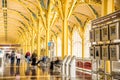 Passengers walking through a bright airport