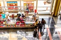 Passengers walking through a bright airport