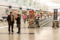 Passengers walking with lugagge in airport