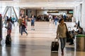 Passengers walking with lugagge in airport