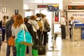 Passengers walking with lugagge in airport