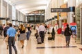 Passengers walking with lugagge in airport