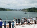 Passengers watch as cruise ship approaches the Atlantic Ocean