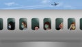 Passengers wearing medical masks for protection from coronavirus are seen through the windows of the airplane