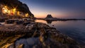 Passetto beach with typical fisherman caves in Ancona, at sunset