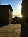 Passignano sul Trasimeno ancient town, Umbria region, Itlay. Ancient alley, arch and flowers Royalty Free Stock Photo